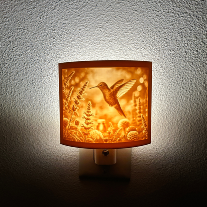 Warm glowing hummingbird lithophane night light featuring a detailed hummingbird hovering among blooming flowers, curved nature-inspired decor for bedrooms, hallways, nurseries, or garden-themed spaces.