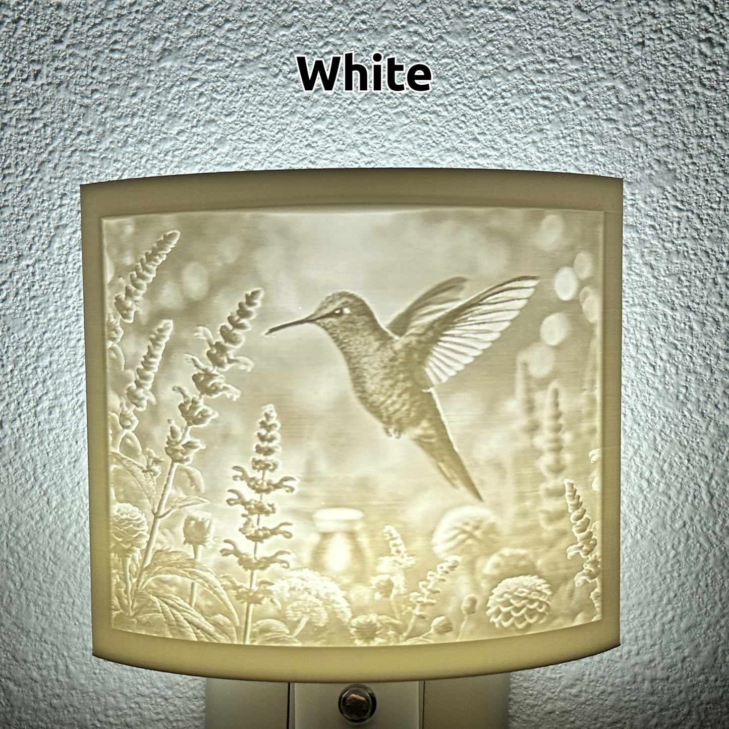 White hummingbird lithophane night light featuring a detailed hummingbird hovering among blooming flowers, softly glowing curved nature-inspired decor for bedrooms, hallways, nurseries, or garden-themed spaces.
