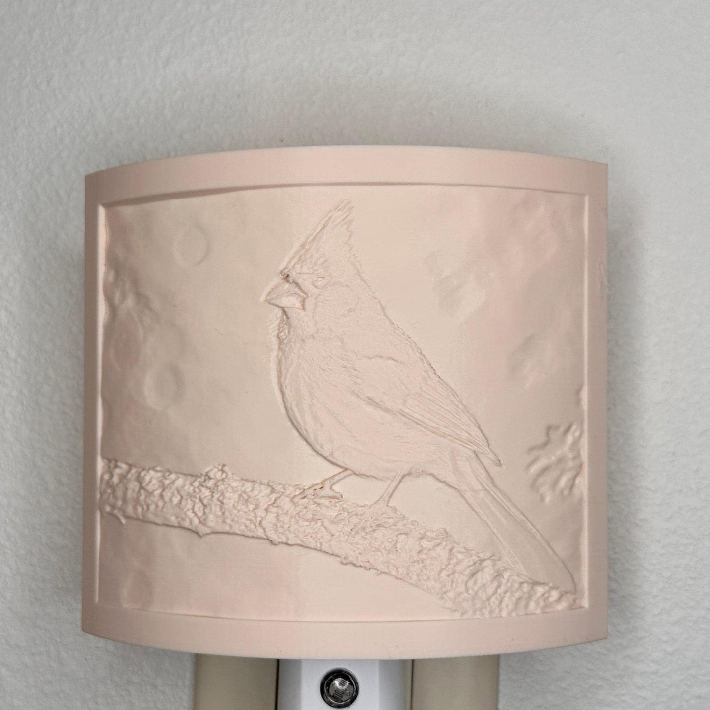 Beige cardinal lithophane night light with embossed bird design featuring a cardinal perched on a tree branch, curved nature-inspired wall decor for bedrooms, hallways, cabins, or cozy living spaces.