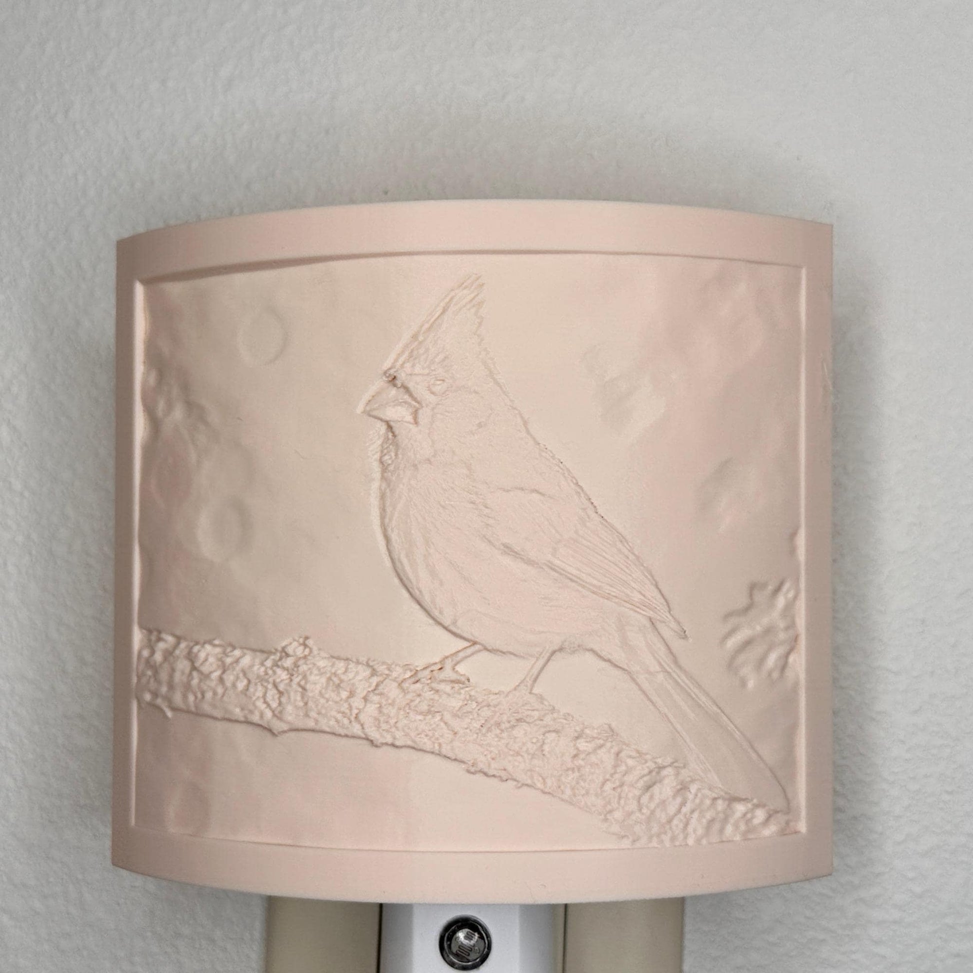 Beige cardinal lithophane night light with embossed bird design featuring a cardinal perched on a tree branch, curved nature-inspired wall decor for bedrooms, hallways, cabins, or cozy living spaces.