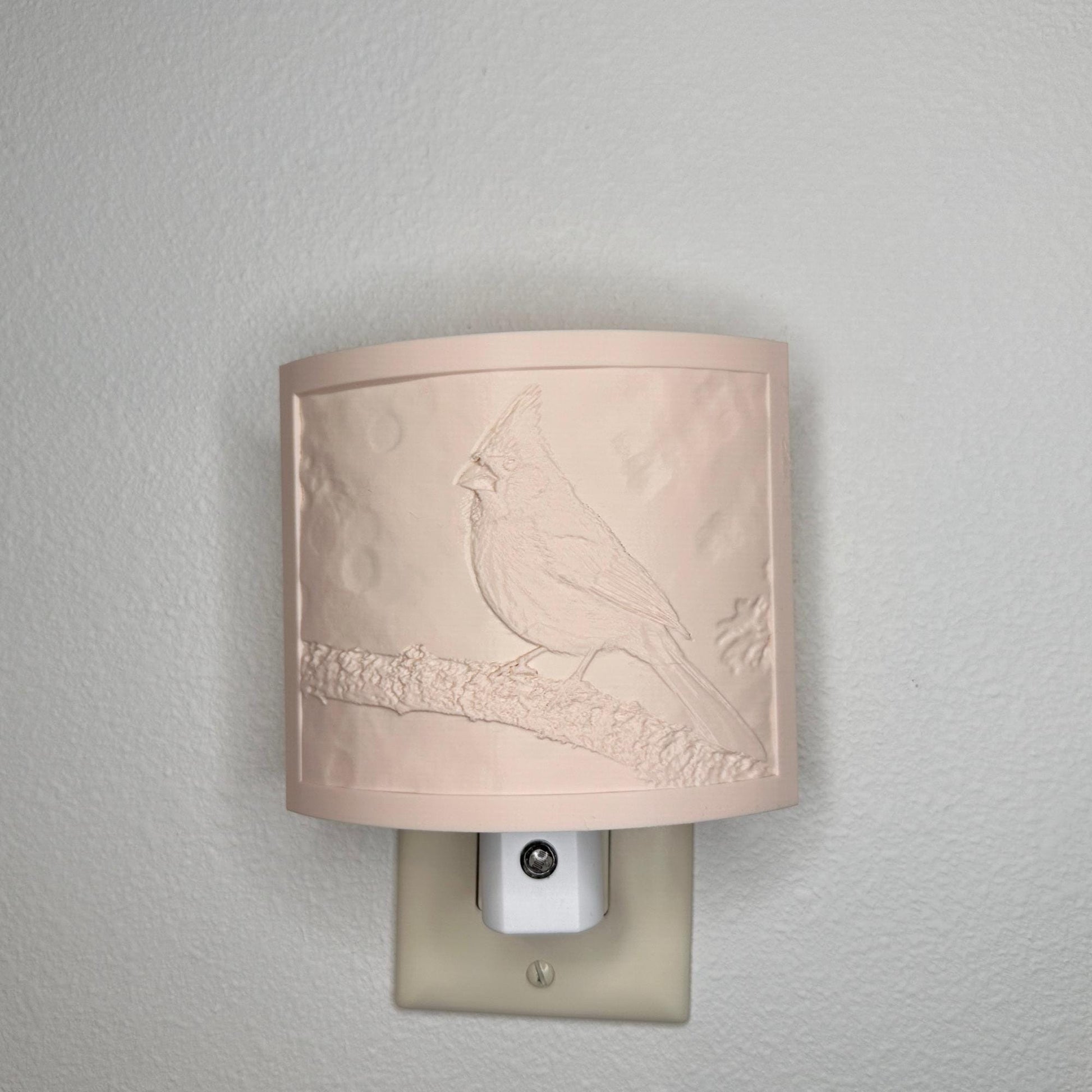 Beige cardinal lithophane night light with embossed bird design featuring a cardinal perched on a tree branch, curved nature-inspired wall decor for bedrooms, hallways, cabins, or cozy living spaces.