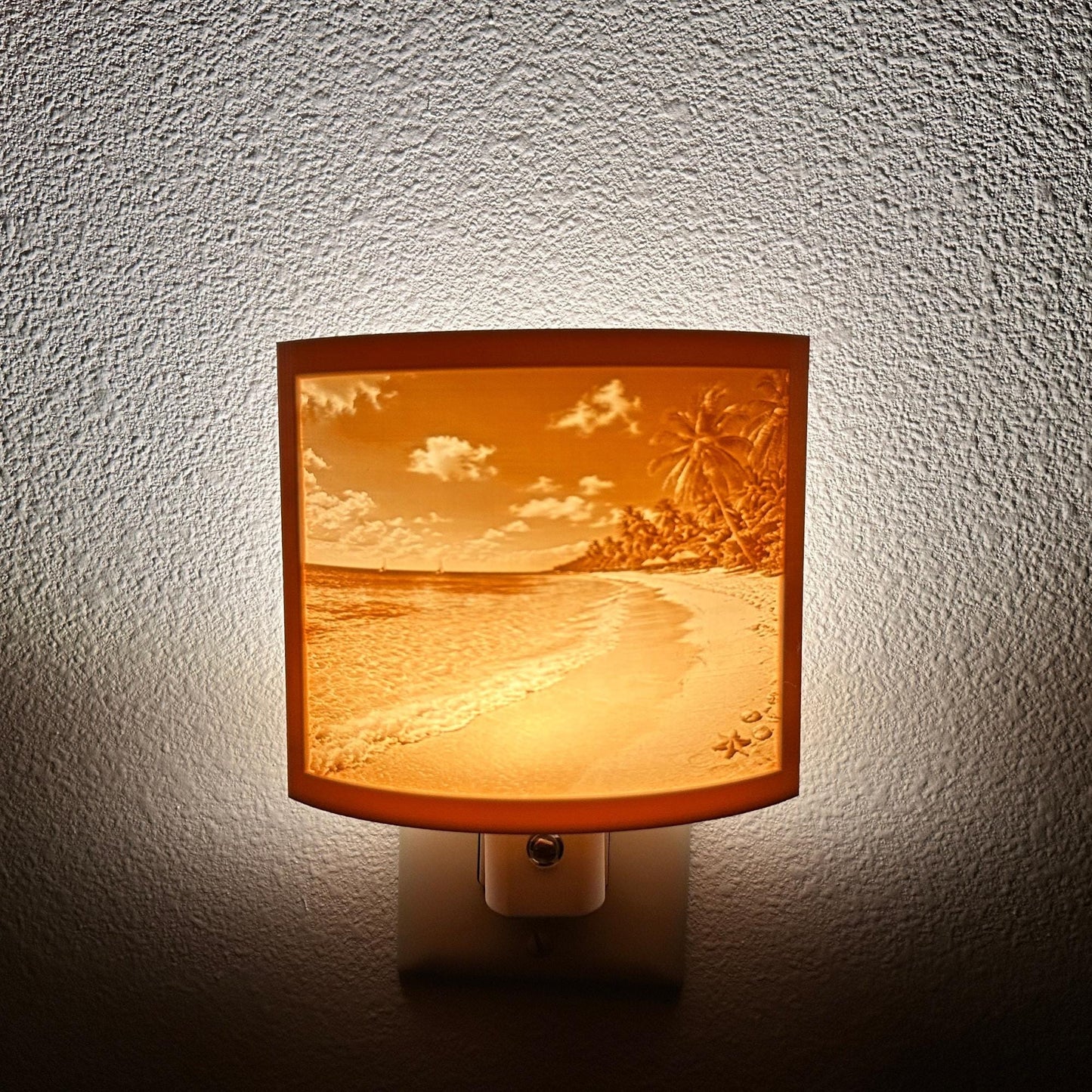 Warm glowing tropical beach lithophane night light featuring palm trees, ocean waves, sandy shoreline, and seashell details, curved coastal decor for bedrooms, bathrooms, beach houses, or relaxing spaces.