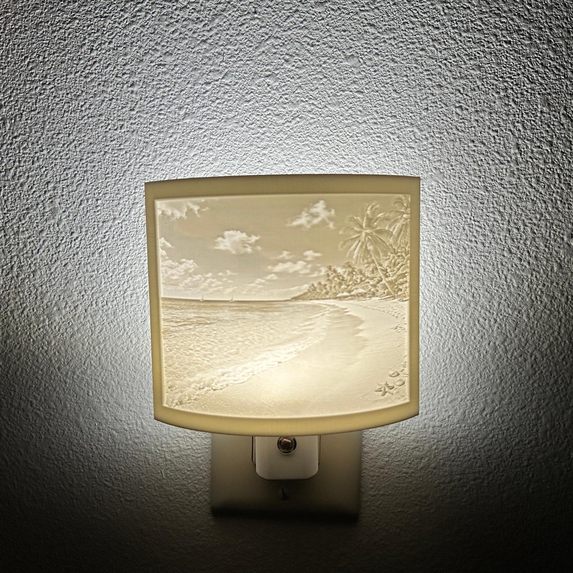 White tropical beach lithophane night light featuring palm trees, ocean waves, sandy shoreline, and seashell details, softly glowing curved coastal decor for bedrooms, bathrooms, beach houses, or relaxing spaces.