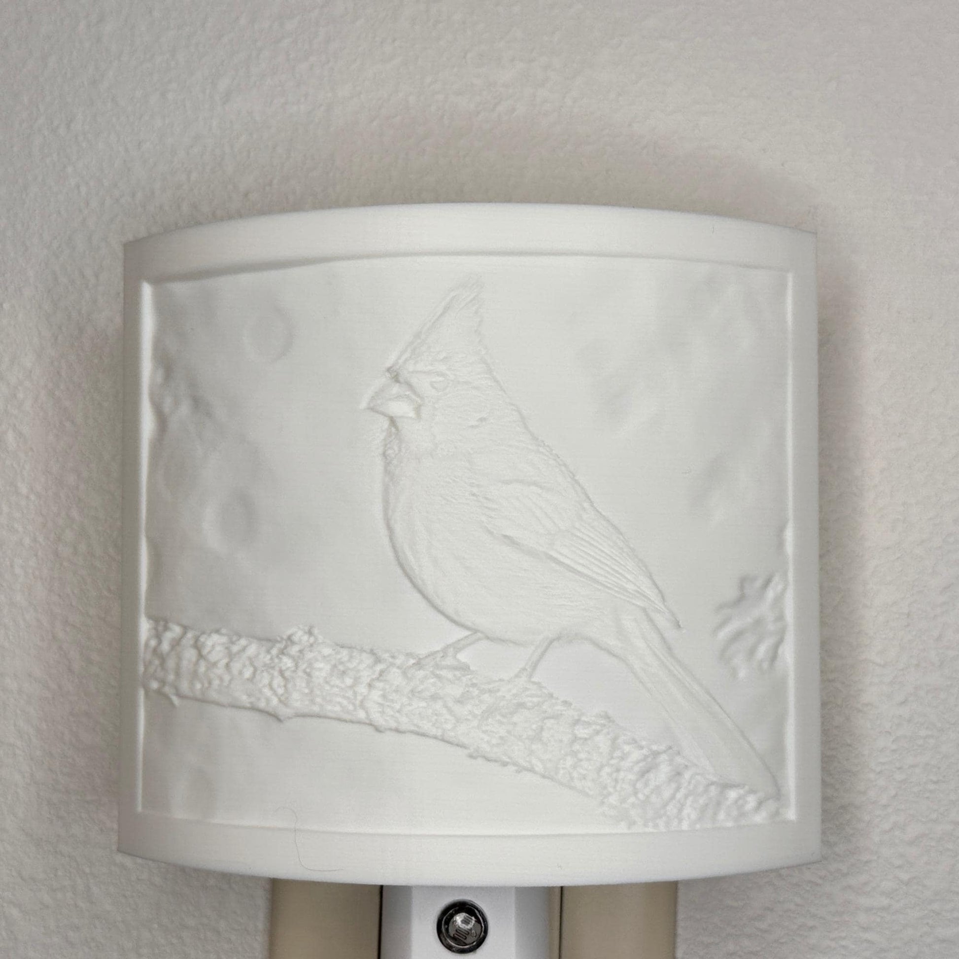 White cardinal lithophane night light with embossed bird design featuring a cardinal perched on a tree branch, curved nature-inspired wall decor for bedrooms, hallways, cabins, or cozy living spaces.