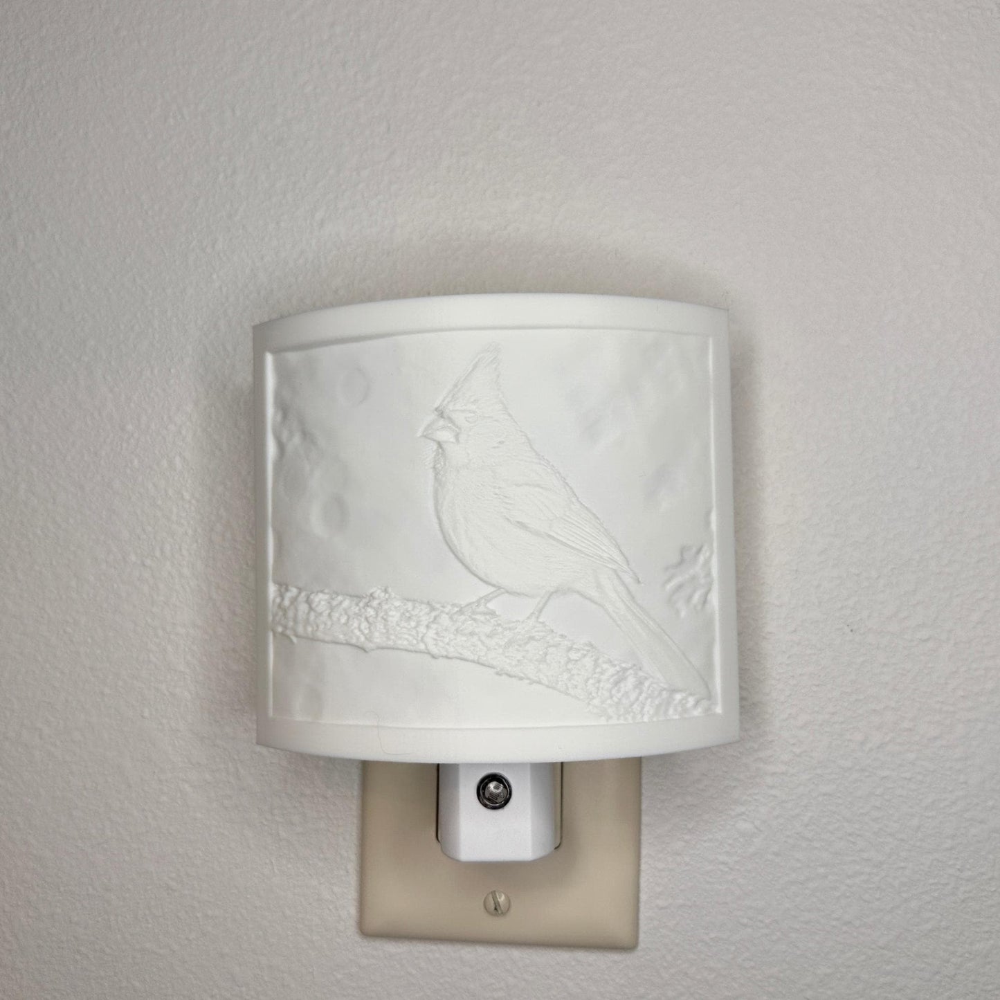 White cardinal lithophane night light with embossed bird design featuring a cardinal perched on a tree branch, curved nature-inspired wall decor for bedrooms, hallways, cabins, or cozy living spaces.