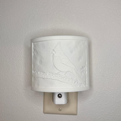 White cardinal lithophane night light with embossed bird design featuring a cardinal perched on a tree branch, curved nature-inspired wall decor for bedrooms, hallways, cabins, or cozy living spaces.