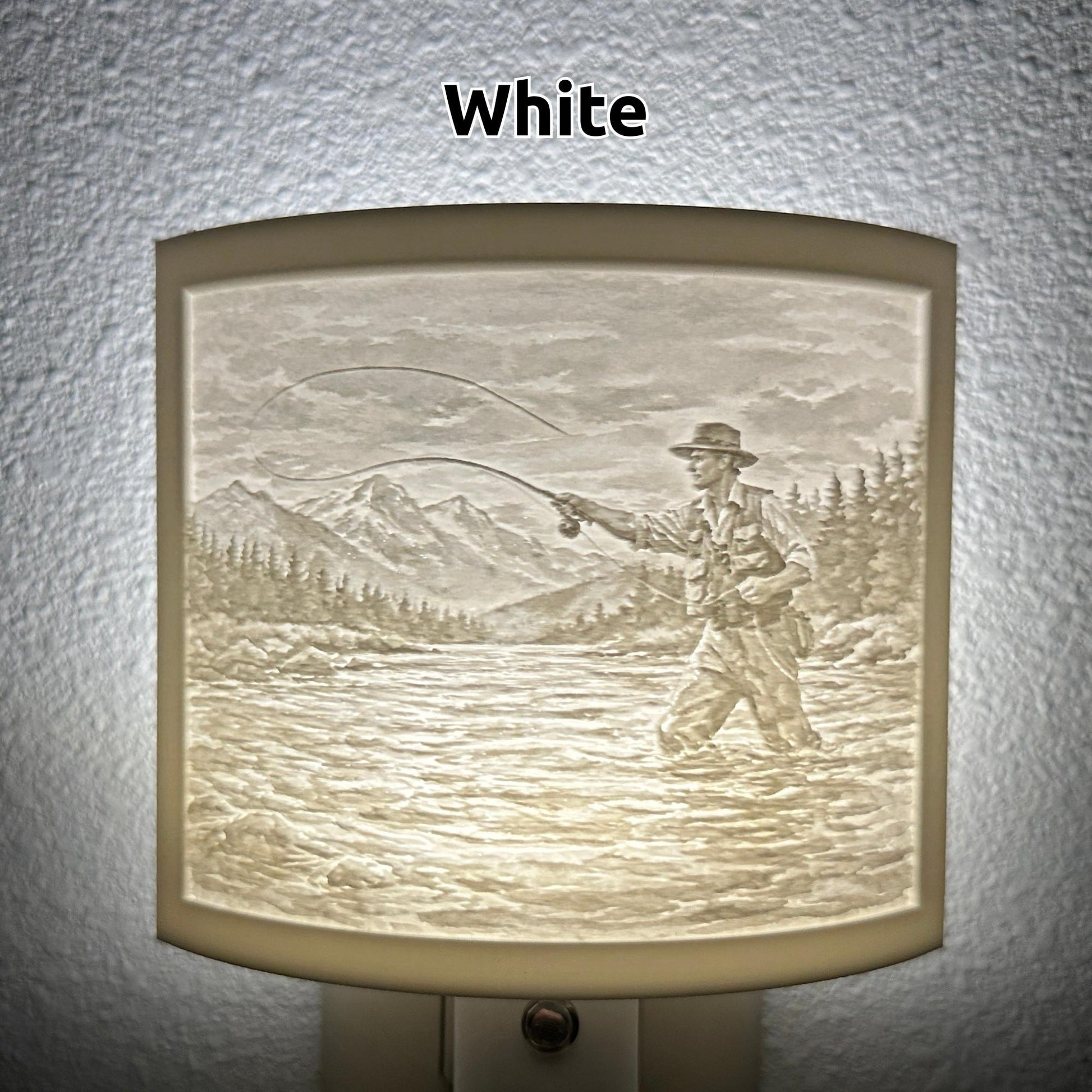White fishing lithophane night light featuring a fly fisherman casting in a mountain river with forest and mountain scenery, softly glowing curved outdoor-themed decor for cabins, lodges, fishing enthusiasts, or rustic spaces.