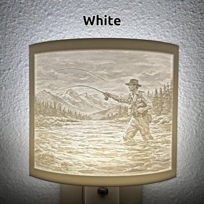 White fishing lithophane night light featuring a fly fisherman casting in a mountain river with forest and mountain scenery, softly glowing curved outdoor-themed decor for cabins, lodges, fishing enthusiasts, or rustic spaces.