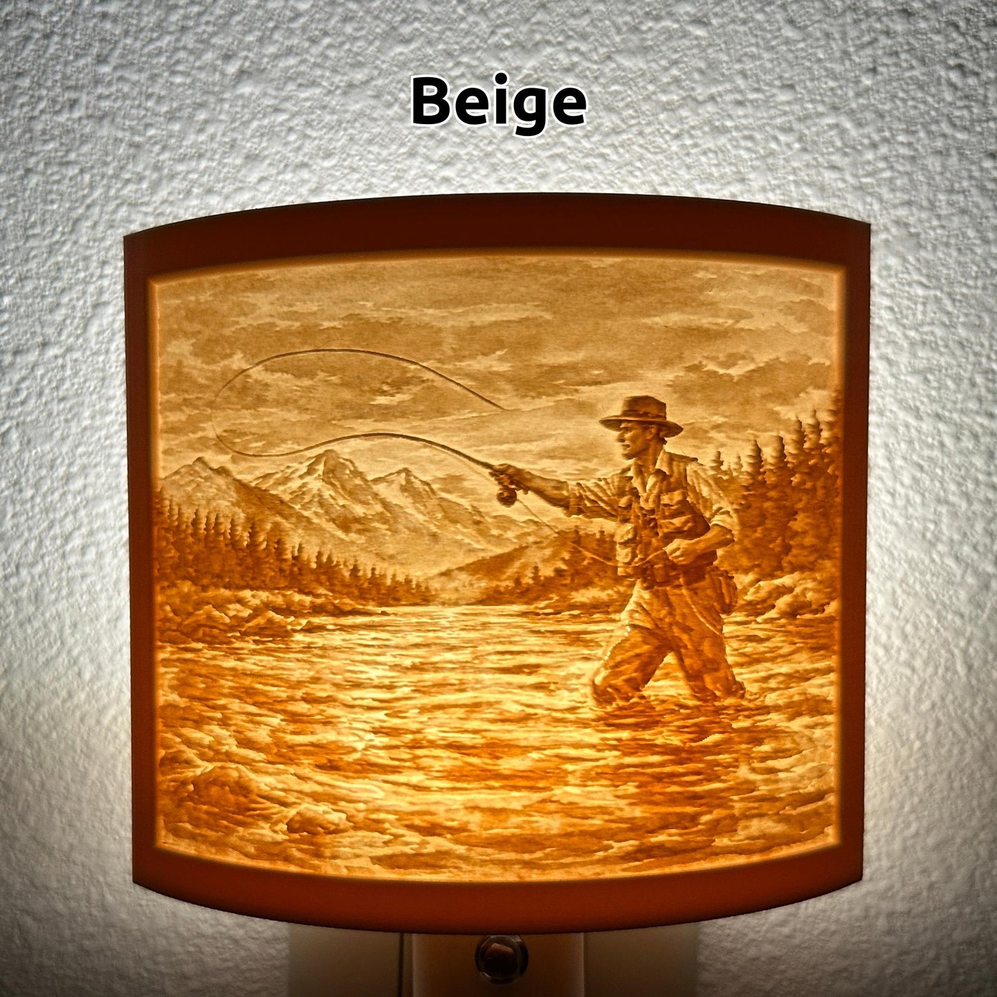 Warm glowing fishing lithophane night light featuring a fly fisherman casting in a mountain river with forest and mountain scenery, curved outdoor-themed decor for cabins, lodges, fishing enthusiasts, or rustic spaces.