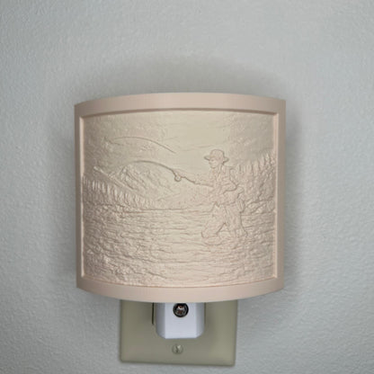 Beige fishing lithophane night light with embossed fly fisherman casting in a mountain river surrounded by forest and mountain scenery, curved outdoor-themed decor for cabins, lodges, fishing enthusiasts, or rustic spaces.