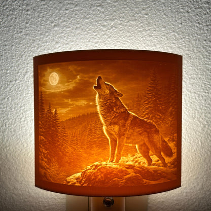 Warm glowing wolf lithophane night light featuring a detailed howling wolf under a full moon in a forest landscape, curved wildlife-themed decor for bedrooms, cabins, lodges, or rustic spaces.