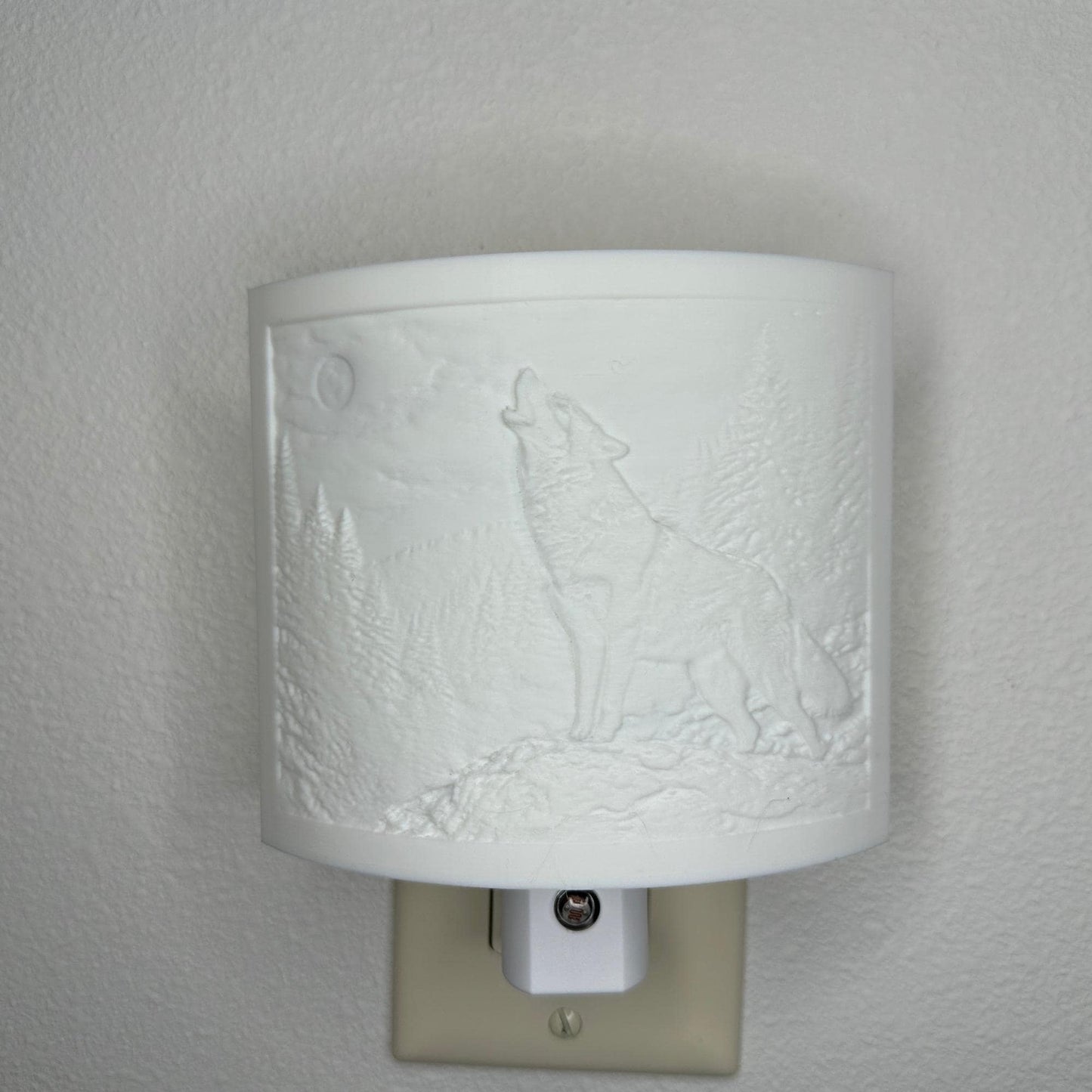 White wolf lithophane night light with embossed howling wolf beneath a full moon in a forest landscape, curved wildlife-themed decor for bedrooms, cabins, lodges, or rustic spaces.
