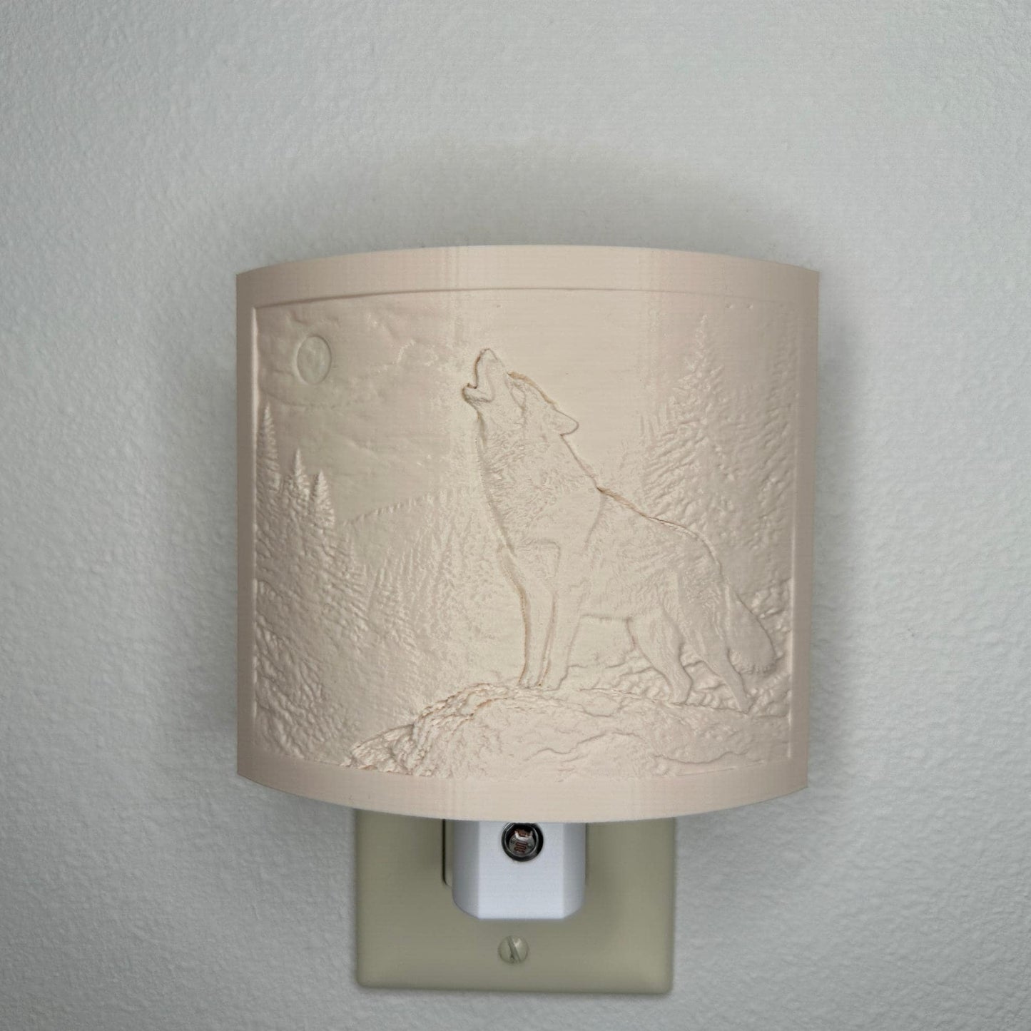 Beige wolf lithophane night light with embossed howling wolf beneath a full moon in a forest landscape, curved wildlife-themed decor for bedrooms, cabins, lodges, or rustic spaces.