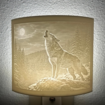 White wolf lithophane night light featuring a detailed howling wolf beneath a full moon in a forest landscape, softly glowing curved wildlife-themed decor for bedrooms, cabins, lodges, or rustic spaces.