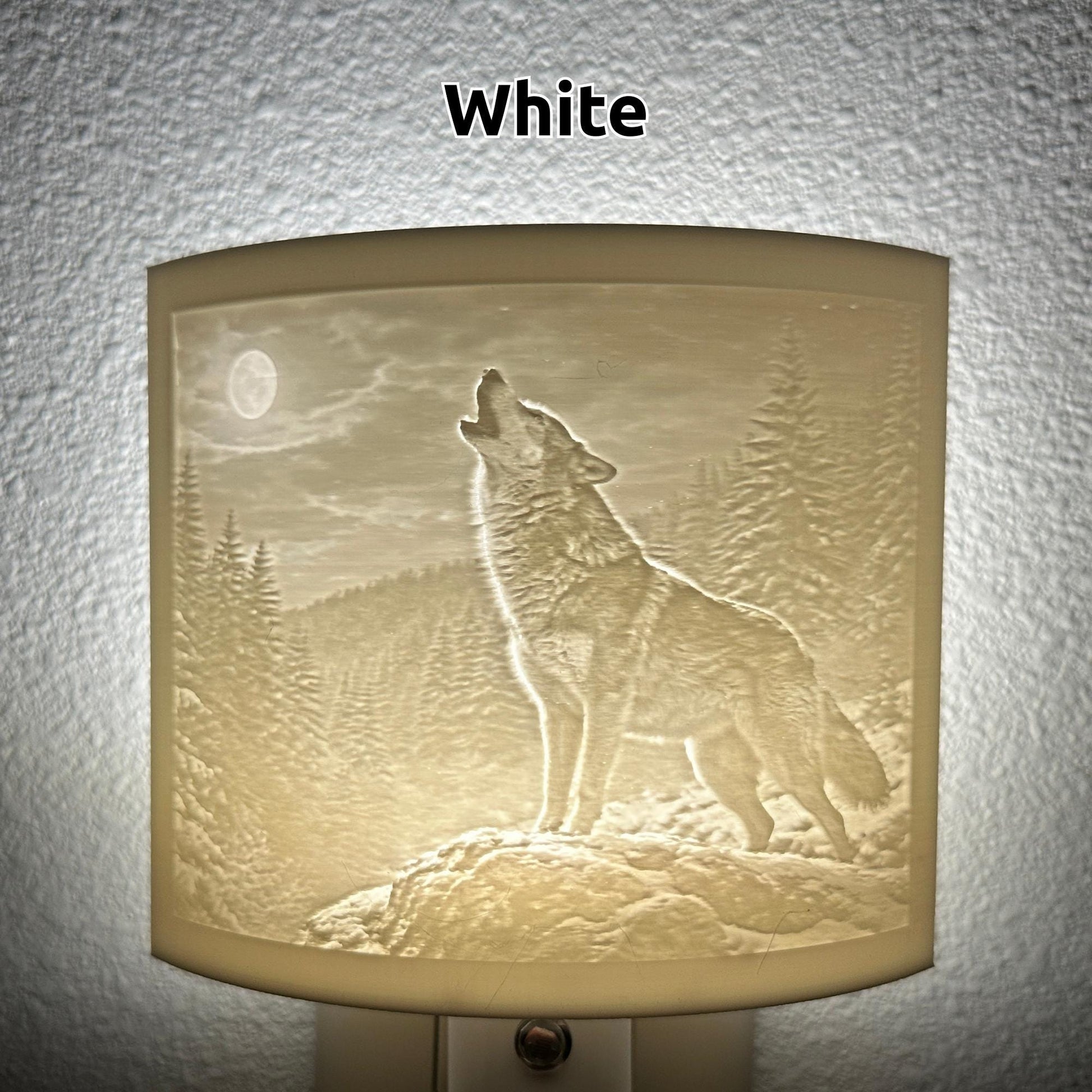 White wolf lithophane night light featuring a detailed howling wolf beneath a full moon in a forest landscape, softly glowing curved wildlife-themed decor for bedrooms, cabins, lodges, or rustic spaces.