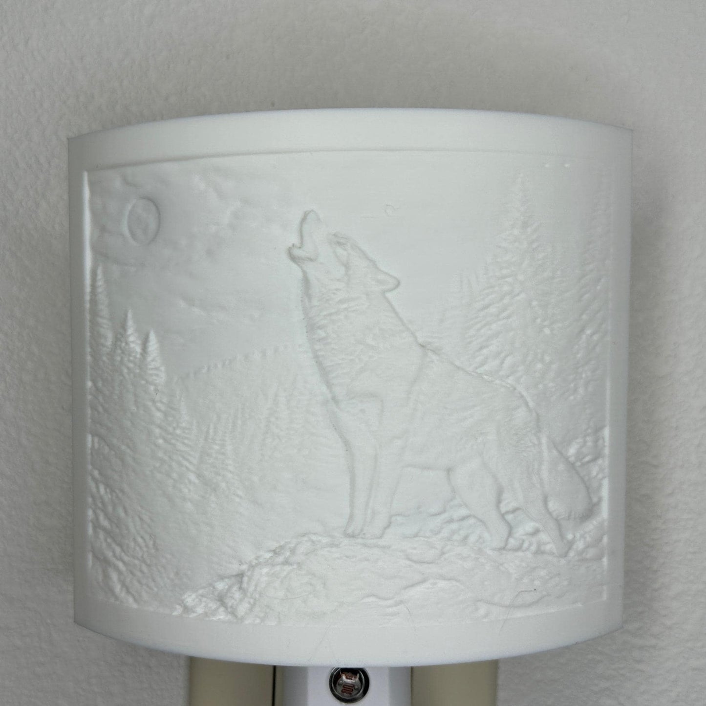 White wolf lithophane night light with embossed howling wolf beneath a full moon in a forest landscape, curved wildlife-themed decor for bedrooms, cabins, lodges, or rustic spaces.